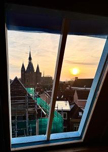a view of a building from a window at Florès Boutique Hotel in Zwolle