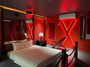 a bedroom with a white bed with red walls at Nhật Tân Hotel Vĩnh Ngọc II- Đông Anh in Dong Anh +24 photos