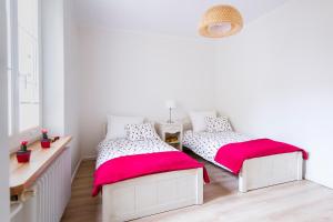 Posteľ alebo postele v izbe v ubytovaní Apartament Na Staromiejskiej