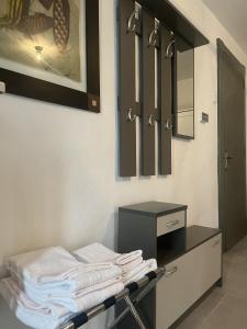 a pile of towels on a drying rack in a bathroom at La Gisina B&B in Gaglianico