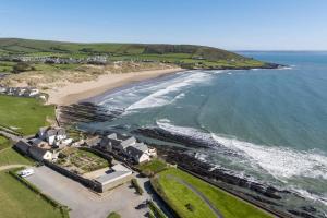 an aerial view of a beach and the ocean at 3 Bed in Croyde oc-hector in Croyde
