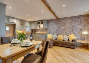 a living room with a couch and a table at 4 Bed in Bala oc-bow66 in Bala