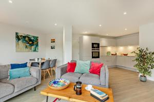 a living room with two couches and a table at 2 Bed in Woolacombe oc-m29811 in Woolacombe