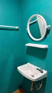 a bathroom with a mirror and a sink at So Cute Hostel, Kai Bae, Koh Chang in Trat +43 photos
