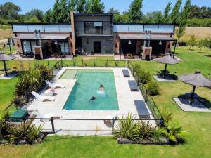 an aerial view of a house with a swimming pool at Terrazas del Monte in San Miguel del Monte