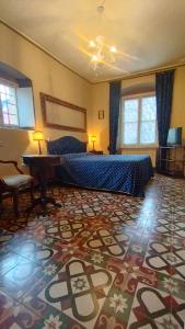 a bedroom with a bed and a large rug at DIMORA della TORRE a due passi dal mare in Sestri Levante