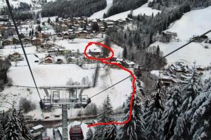 a ski resort in the snow with a red line at Apartmenthaus Kristall - inclusive Wasserwelt Wagrain mit Sauna in Wagrain