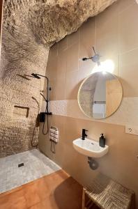 a bathroom with a sink and a mirror at AIRE Vejer - recién reformado 2026 in Vejer de la Frontera +54 photos