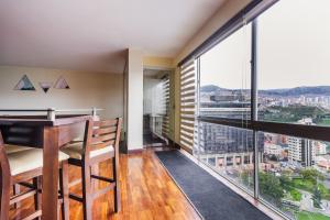 a dining room with a view of the city at Luxstone Executive & Suites in La Paz