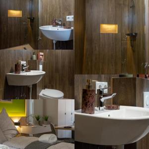 a bathroom with a sink and a toilet and a sink at Luani appartments in Krefeld +27 photos
