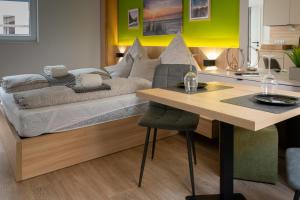 a living room with a couch and a table at Luani appartments in Krefeld