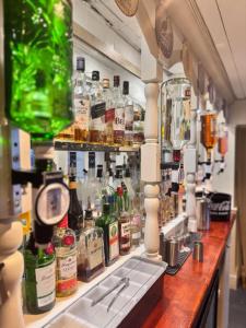 a bar with a lot of bottles of alcohol at The Wrey Arms in Barnstaple