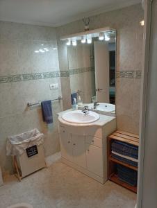 a bathroom with a sink and a mirror at Casona MilaWen in Potes +19 photos