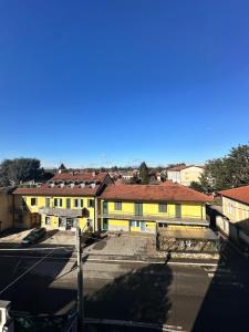 a view of a city with yellow buildings at Dante appartamento in Fagnano Olona