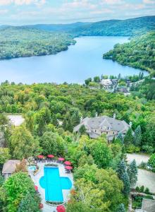 an aerial view of a resort with a lake at Cap Tremblant in Mont-Tremblant