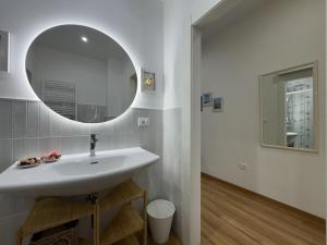 a bathroom with a sink and a mirror at Le Jardin Fleuri in Castelluccio Valmaggiore +69 photos