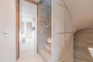 a hallway with a staircase in a house at Coliving - Bord de Meuse - L'instant in Oupeye