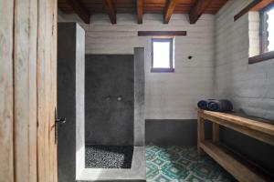 a bathroom with a shower in a wooden building at Casa Estrella, Mountain View in Malinalco +41 photos