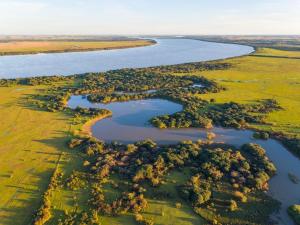 an aerial view of an island in a river at La estancia Yapeyú in Yapeyú