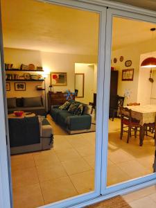 a living room with a couch and a table at Villa Buras in Skinária