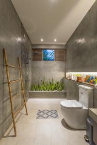 a bathroom with a shower and a toilet and a window at ONA Garden Villa in Galle +84 photos