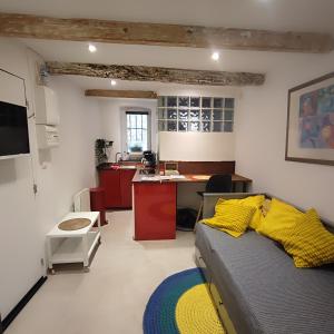 a room with a kitchen and a bed in it at Little studio in the old town in Vence
