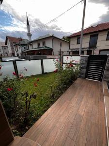 a balcony with a view of a body of water at Apartman Tajchi in Sarajevo