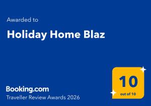 a yellow sign with the words holiday home blazer at Holiday Home Blaz in Ljubuški