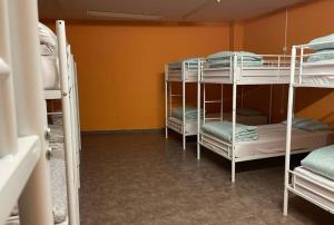 a room with three bunk beds in a room at Hostel valencia ruzafa in Valencia