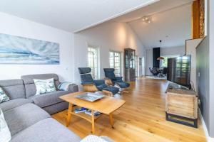 a living room with a couch and a table at VGO824-Boras-Nabbagatan-38 in Borås