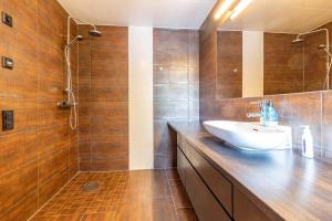 a bathroom with a sink and a shower at VGO824-Boras-Nabbagatan-38 in Borås +26 photos