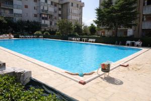a large swimming pool in the middle of a building at Brendon Suite in Brindisi