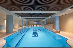 a large swimming pool in a hotel room at Grand Hotel Misurina in Misurina
