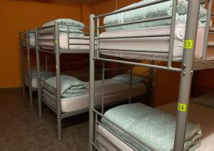 a group of bunk beds in a room at Hostel valencia ruzafa in Valencia