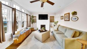 a living room with a couch and a fireplace at In-ground pool, hot tub, fire pit, massage room! in Tulsa