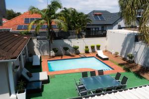 an overhead view of a swimming pool in a house at Pearlstone in Durban