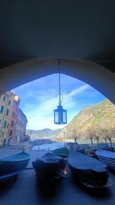 a view of a bridge with boats and a light at DonnaBarbara in Vernazza