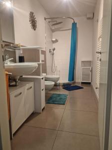 a bathroom with a sink and a toilet and a shower at Ricky-Lerua Holiday Residence in Florence +163 photos
