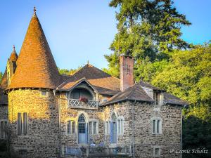 an old stone house with a turret and a window at Château de Najade in Sainte-Sévère-sur-Indre
