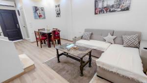 a living room with a couch and a table at 325 · 2BR Townhouse 2 Bath TV in Sheikh Zayed