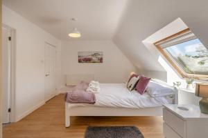 a bedroom with a bed and a window at 2 Bed in Shipham oc-s31934 in Shipham