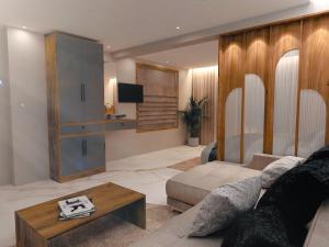 a living room with a couch and a table at Elara Residency Cheravathur in Cheruvattūr