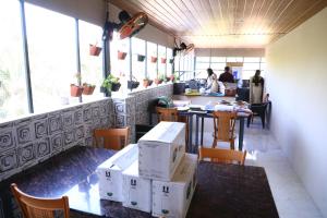 a room with boxes on the tables in a restaurant at Elara Residency Cheravathur in Cheruvattūr