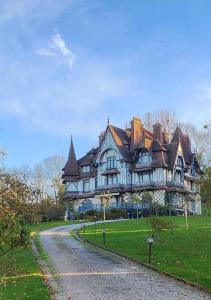 a large house with a road in front of it at Appartement 1 Chambre 4 Pers - Piscine Chauffé - Parking Gratuit - Vue Golf Deauville - La Deauvillaise Résidence du Golf in Deauville
