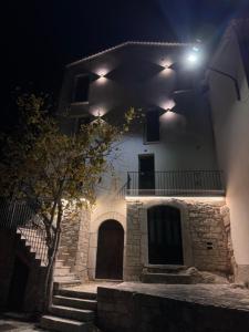 a building with a staircase leading up to it at night at Mille Mt Suites - Cercemaggiore in Cercemaggiore