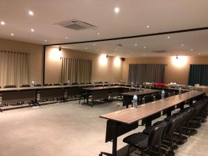a large room with long tables and chairs at Nosy Manga - Hotel Ivato Airport in Antananarivo +145 photos