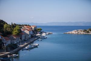 a group of boats are docked in a body of water at Apartments Ana in Lastovo