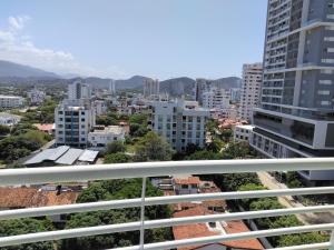 a view of a city from a balcony at Rodadero brisas marinas in Gaira