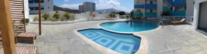 a large swimming pool in the middle of a building at Rodadero brisas marinas in Gaira