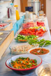 a buffet with many plates of food on a table at Otel Kefalos in Gokceada Town +22 photos
